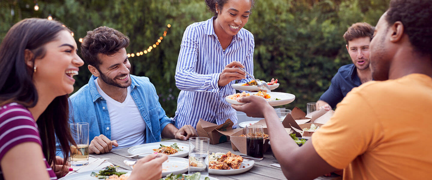 friends outdoor dinner hero