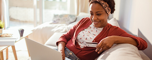 Medium Woman Using Credit Card On Laptop