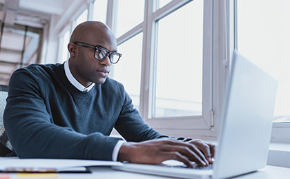 Small Businessman Working On His Laptop
