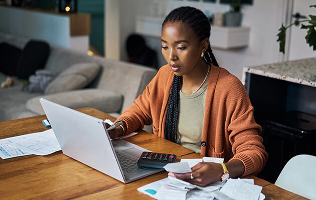 Large Black Women Calculating Bills And Finance Planning