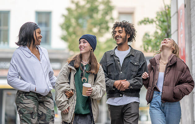 Large Diverse Friend Group Walking And Hanging Out Together