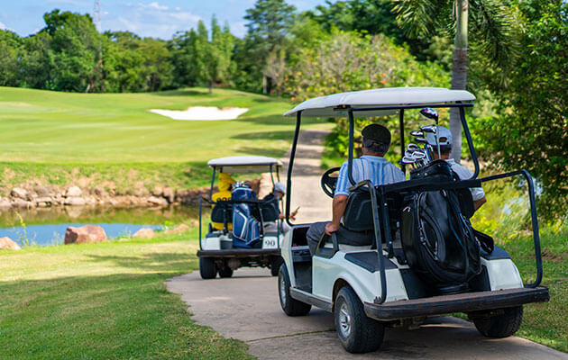 Large Golf Carts With People On Golf Course
