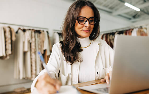 Large Women Working On Laptop In A Store