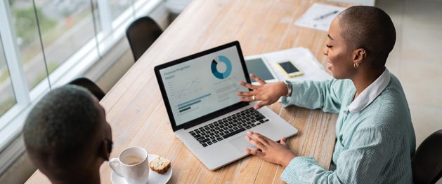 woman reviewing credit score on laptop hero