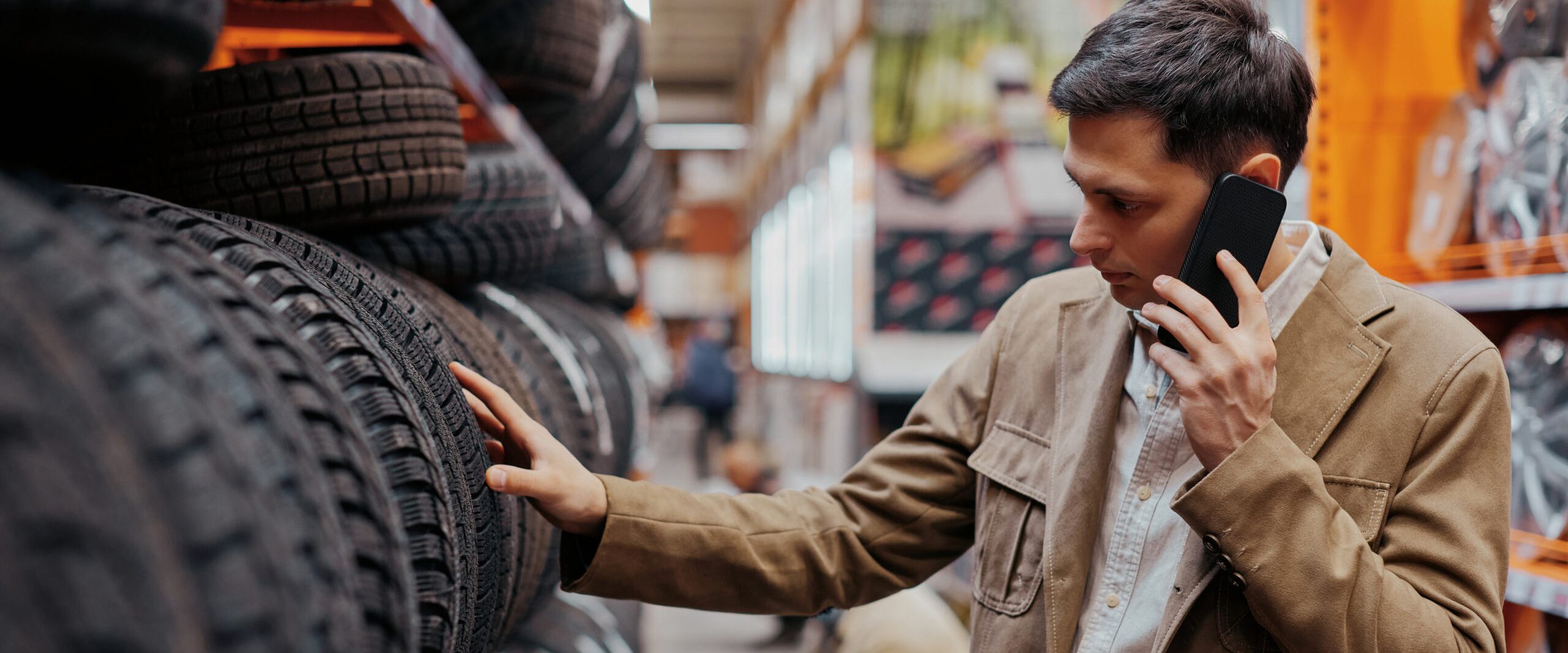 Hero Men Shopping For Tires In Store