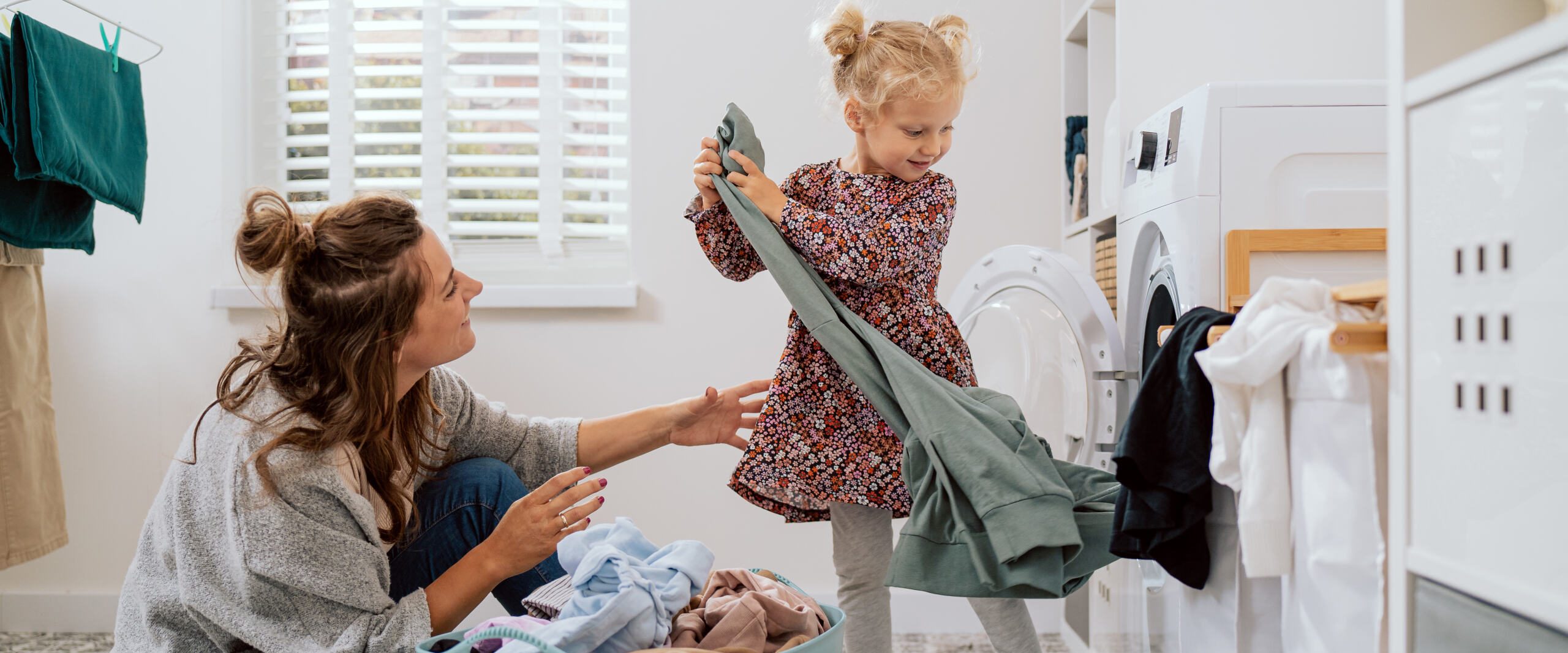 mom daughter doing laundry hero