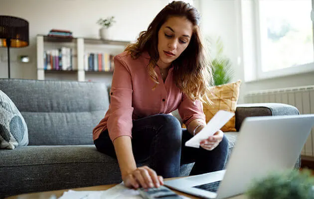 Large Young Woman Calculating Bill