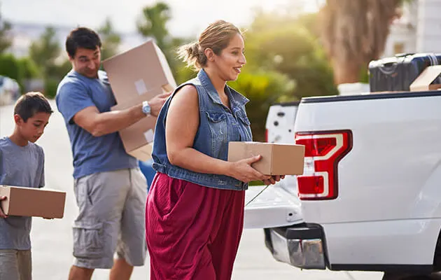 family unloading truck large